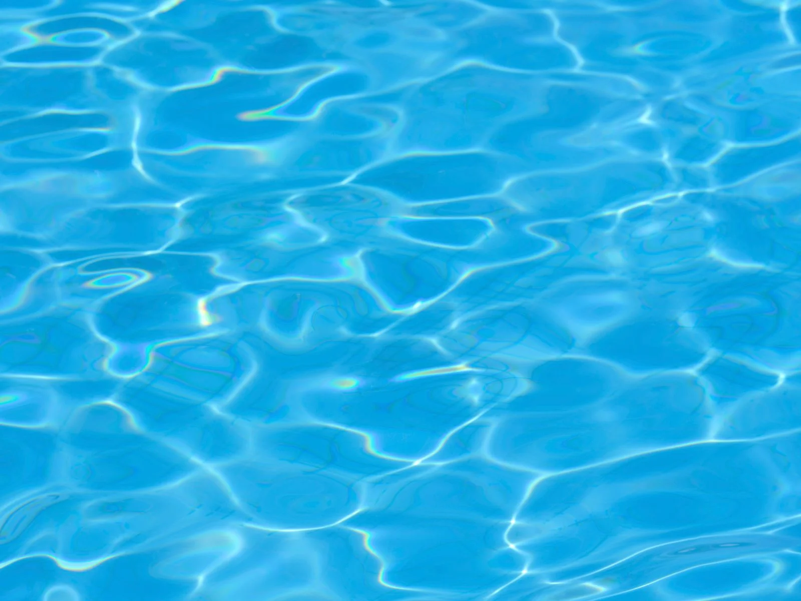Illustrative close-up of ripples in swimming pool water